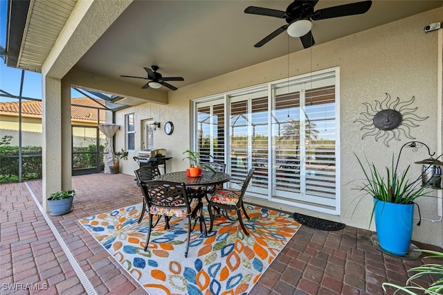 view of patio with grilling area and ceiling fan