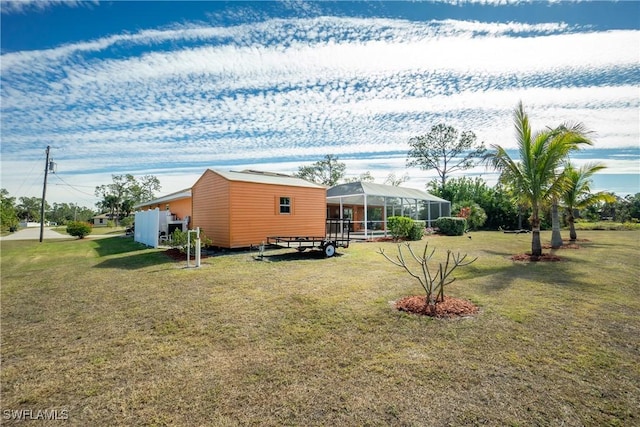 view of yard featuring a lanai