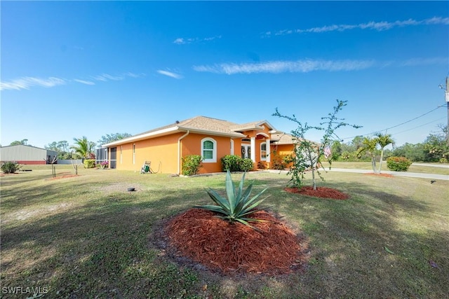 ranch-style home featuring a front lawn