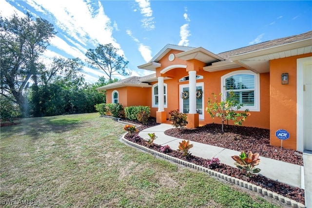 view of front of house with a front yard