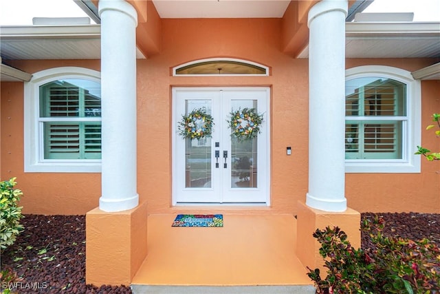 property entrance featuring french doors