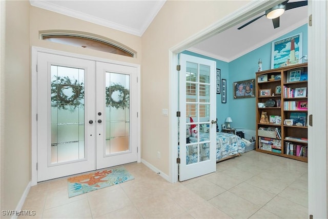 entryway featuring french doors, ornamental molding, and light tile patterned floors