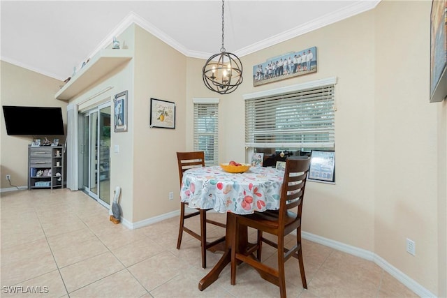 tiled dining area featuring ornamental molding and a chandelier