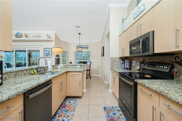 kitchen featuring decorative light fixtures, sink, light brown cabinets, and black appliances