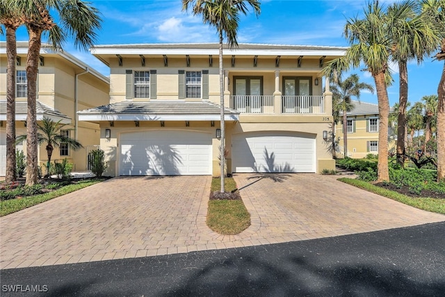 view of front of house with a balcony and a garage