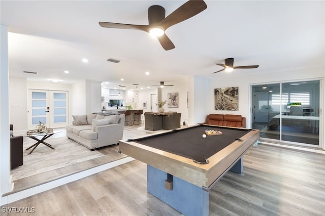 playroom with light wood-type flooring, french doors, and pool table