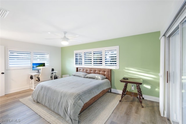 bedroom featuring a closet, hardwood / wood-style flooring, and ceiling fan