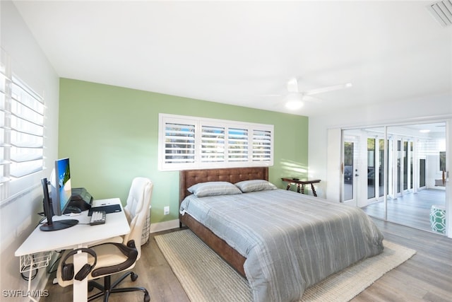 bedroom with ceiling fan, light wood-type flooring, access to outside, and french doors