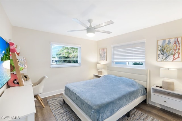 bedroom featuring ceiling fan and dark wood-type flooring