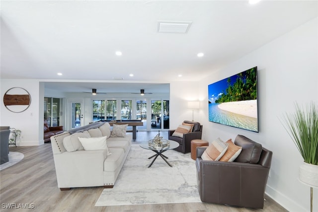 living room with light hardwood / wood-style floors