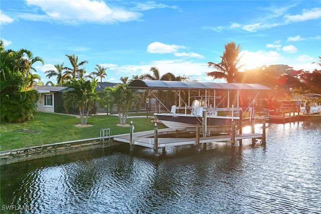 dock area featuring a yard and a water view