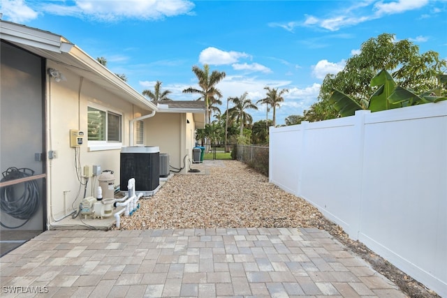 view of yard featuring a patio area and central AC