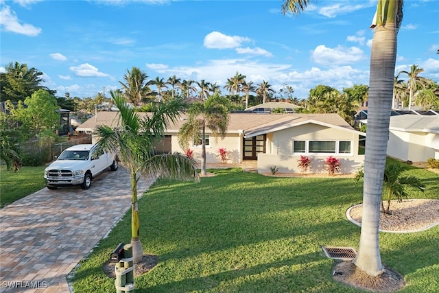 single story home featuring a front yard