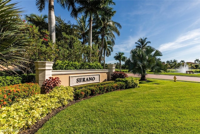 community sign featuring a lawn