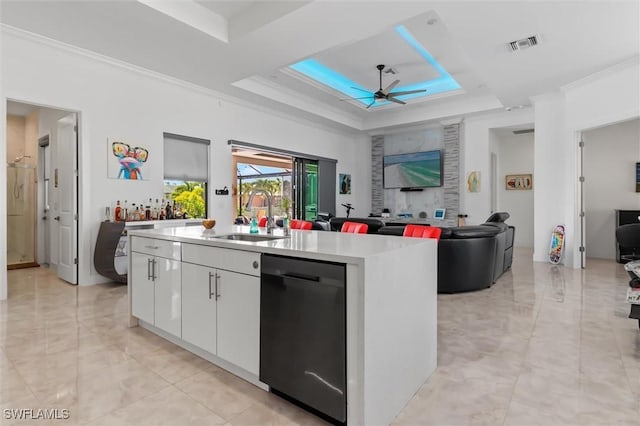 kitchen featuring white cabinetry, sink, a kitchen island with sink, and dishwasher