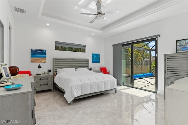 bedroom featuring ceiling fan, access to exterior, and a raised ceiling