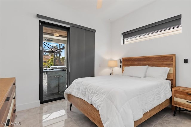 bedroom featuring access to outside and ceiling fan