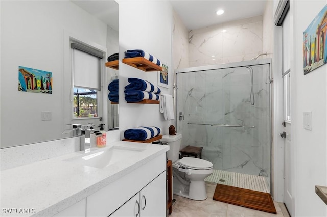 bathroom featuring vanity, toilet, and a shower with door