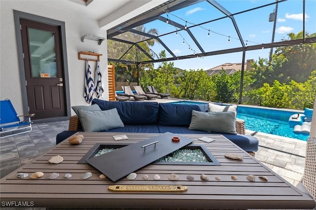 view of patio / terrace featuring an outdoor living space and glass enclosure