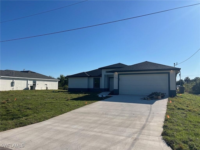 view of front of house with central air condition unit, a garage, concrete driveway, and a front yard