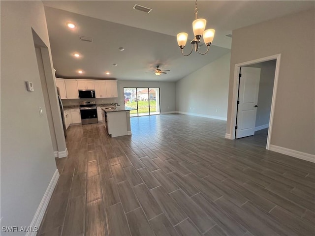 kitchen featuring visible vents, dark wood finished floors, open floor plan, appliances with stainless steel finishes, and white cabinets