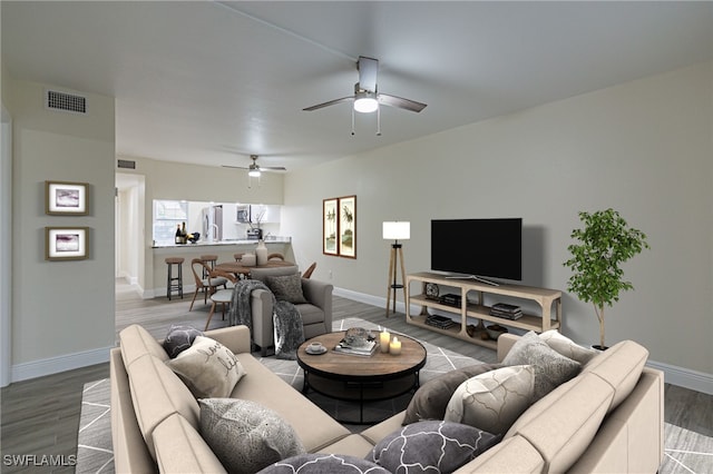 living room featuring ceiling fan and hardwood / wood-style floors