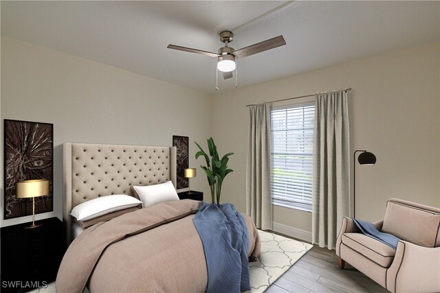 bedroom with ceiling fan and light hardwood / wood-style flooring