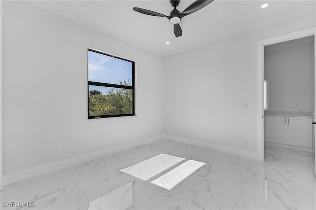 unfurnished room with ceiling fan