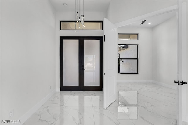 foyer entrance featuring french doors