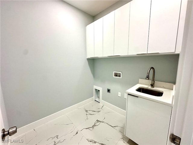 laundry room featuring cabinets, washer hookup, sink, and hookup for an electric dryer