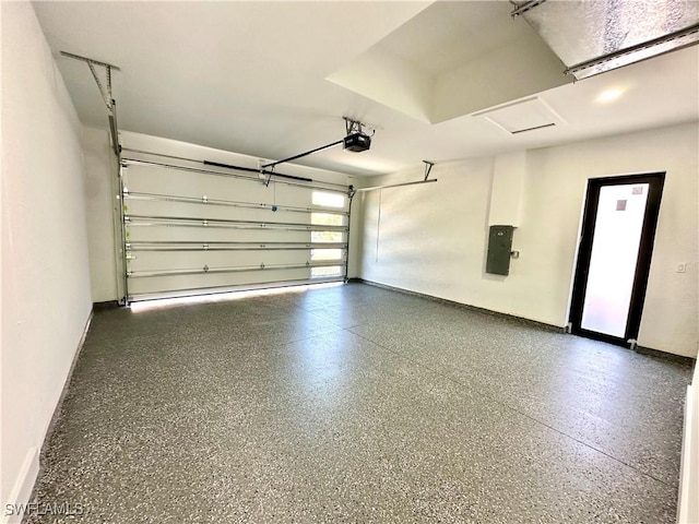 garage featuring a garage door opener and electric panel