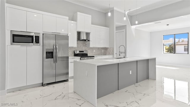 kitchen featuring decorative backsplash, wall chimney exhaust hood, appliances with stainless steel finishes, marble finish floor, and white cabinetry