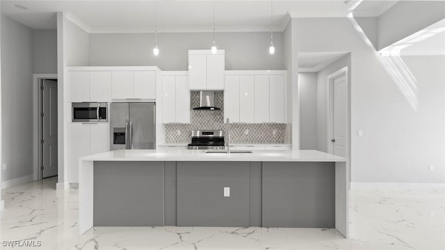 kitchen featuring stainless steel appliances, marble finish floor, white cabinetry, and wall chimney range hood