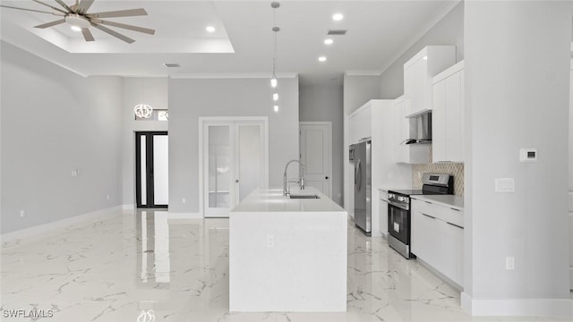 kitchen featuring marble finish floor, a center island with sink, appliances with stainless steel finishes, and white cabinets