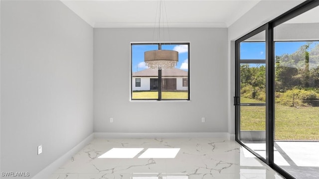 interior space featuring marble finish floor, plenty of natural light, and baseboards