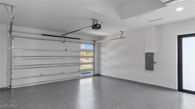 garage featuring a garage door opener, electric panel, and baseboards