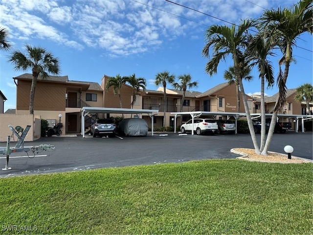 view of car parking with a lawn