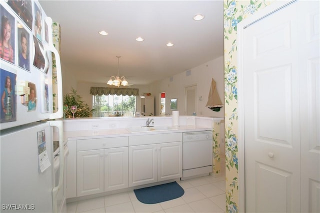 bathroom with vanity and a notable chandelier