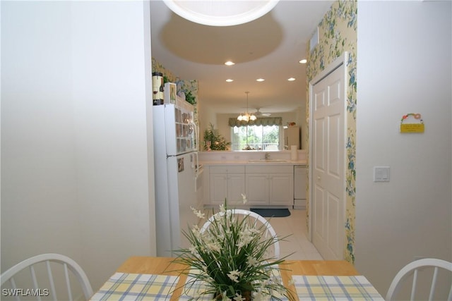 tiled dining area featuring sink