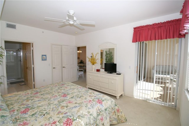 carpeted bedroom with ceiling fan and connected bathroom