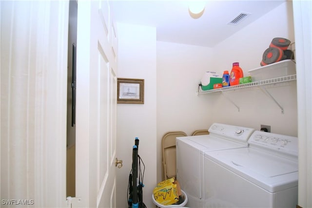 washroom with independent washer and dryer