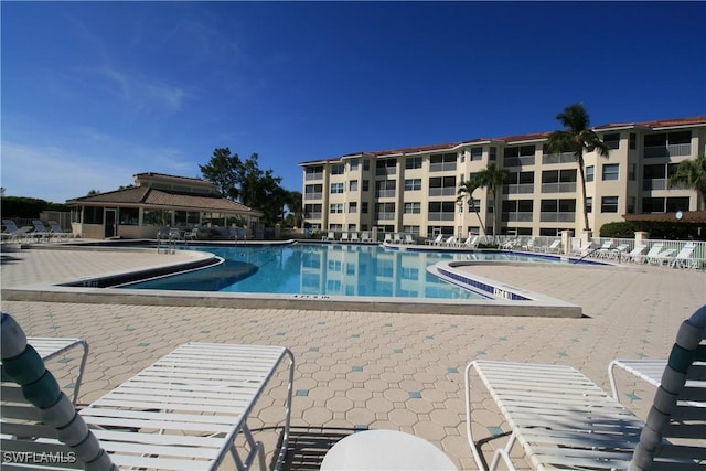 view of swimming pool featuring a patio area