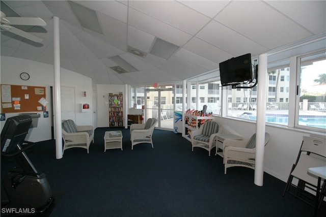 interior space with ceiling fan