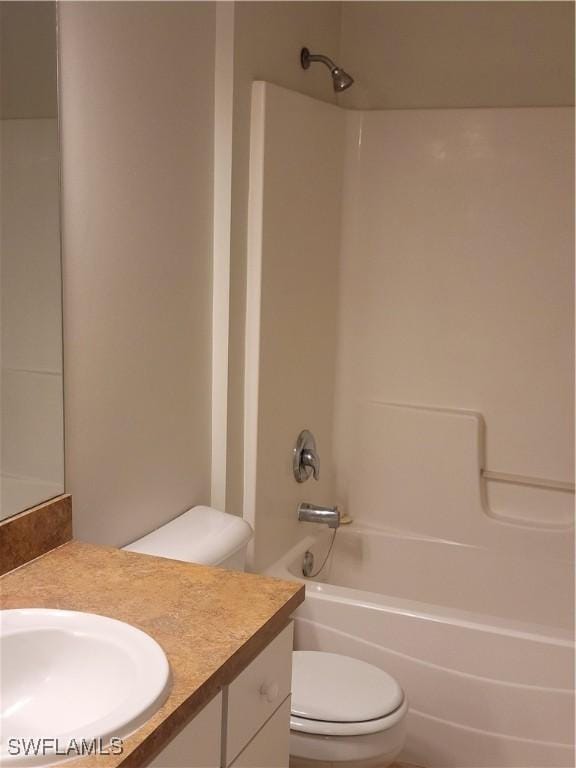 full bathroom with vanity, shower / washtub combination, and toilet