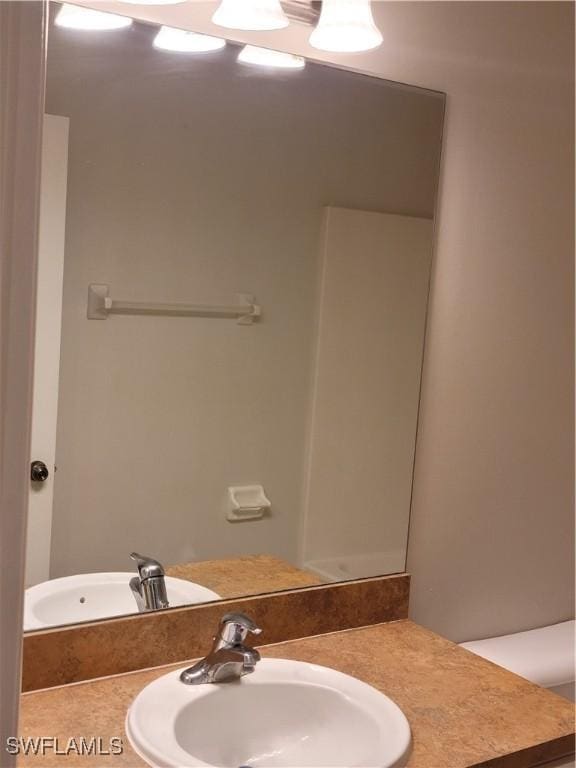 bathroom with vanity and toilet