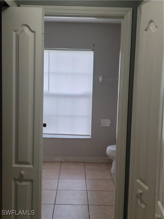 bathroom featuring tile patterned floors and toilet