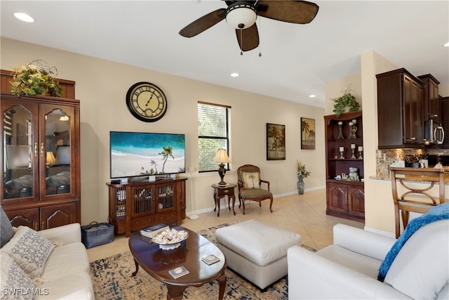 tiled living room with ceiling fan