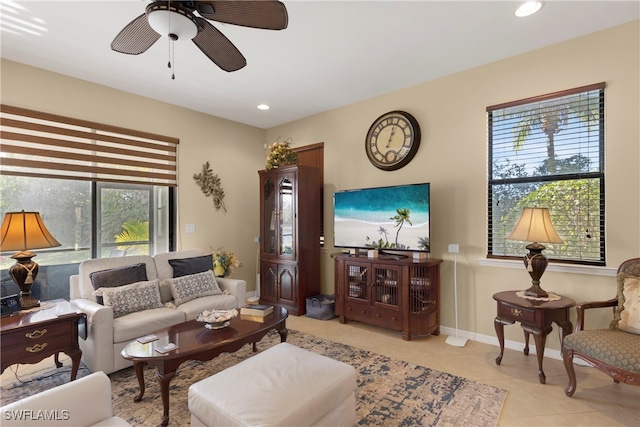 tiled living room featuring ceiling fan