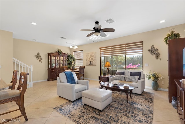 living room with light tile patterned floors and ceiling fan