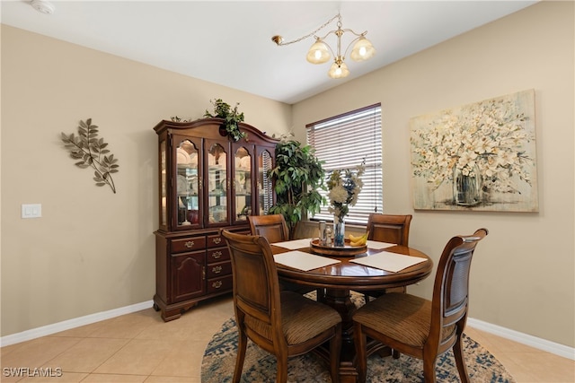 tiled dining space with an inviting chandelier